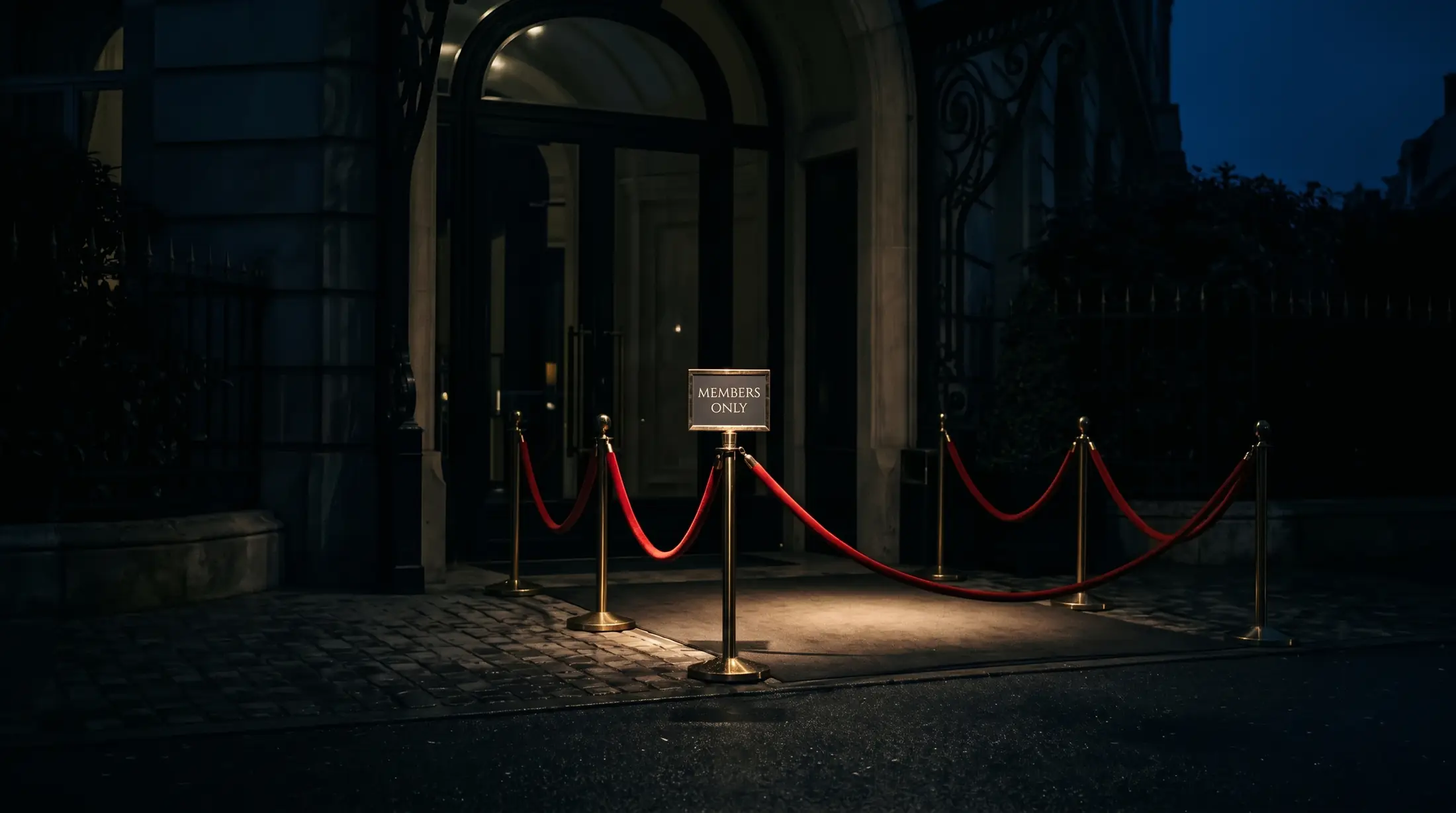 An empty event entrance, spotlit, at night